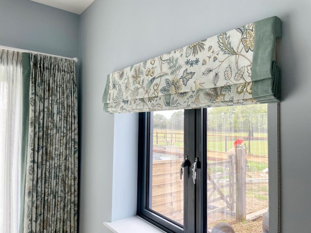 blackout blinds in roman design for gorgeous bedroom with pencil pleat curtains